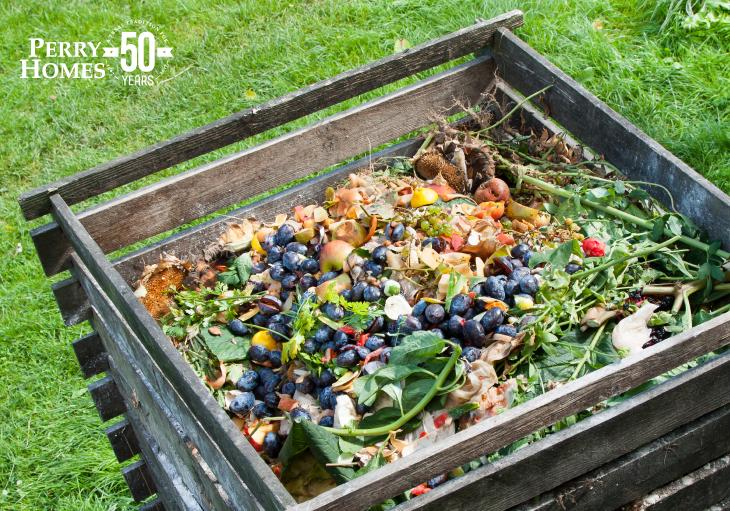 wood compost box full of discarded produce